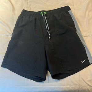 Nike swim trunks with green stripe